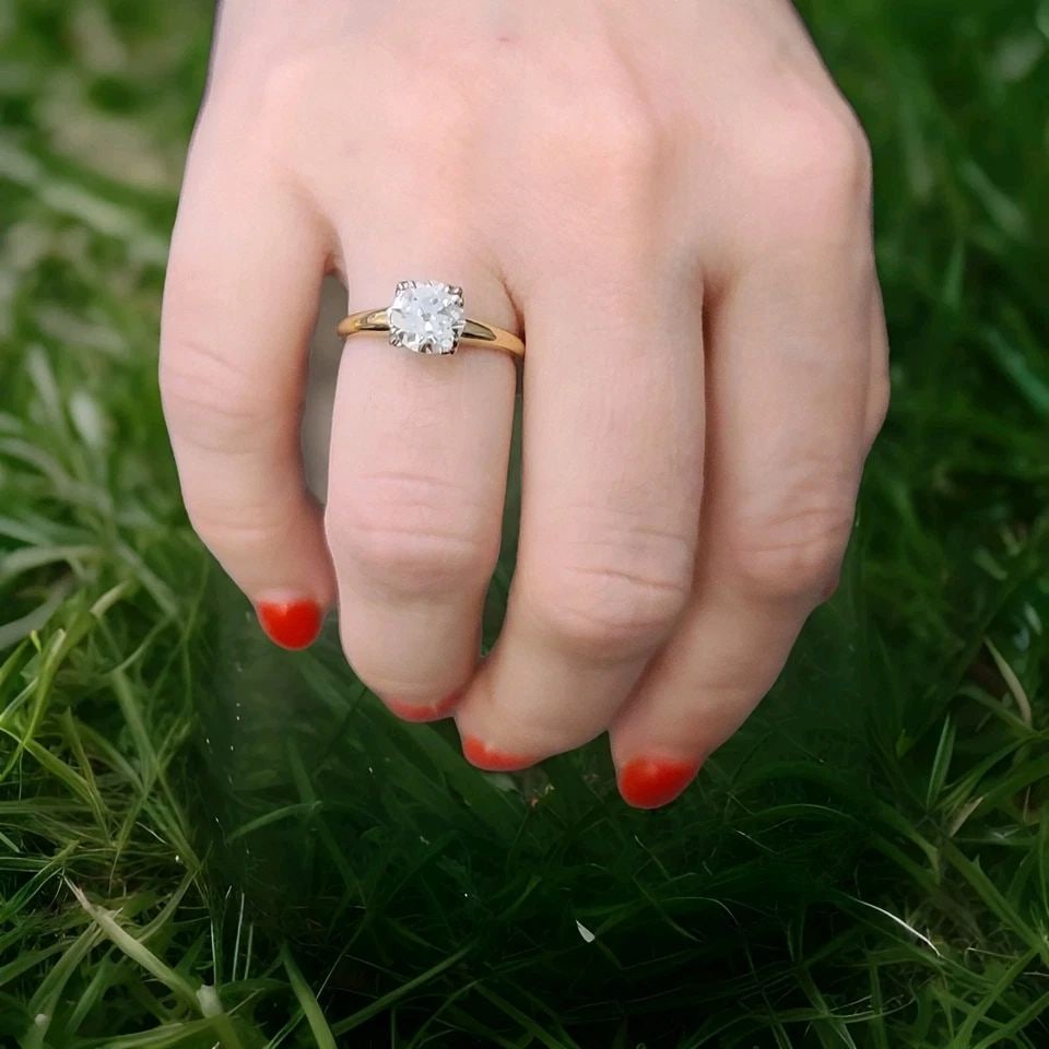 VINTAGE 18K TWO-TONE GOLD ENGAGEMENT RING 1.45CT. NATURAL OLD EURO ROUND DIAMOND: This is a vintage 18k - 14k two-tone gold engagement ring with a 1.45ct natural old euro round diamond. The ring features a cocktail style with a prong setting and is certified by AGI. The diamond col