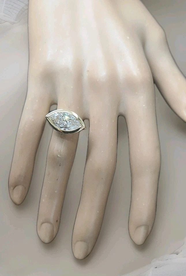 VINTAGE 14K YELLOW GOLD ENGAGEMENT RING 5.00CT.LAB-GROWN MARQUISE DIAMOND: VINTAGE 14K YELLOW GOLD ENGAGEMENT RING 5.00CT.LAB-GROWN MARQUISE DIAMOND This stunning vintage engagement ring is expertly crafted in rich 14K yellow gold and showcases a breathtaking lab-grown marqu
