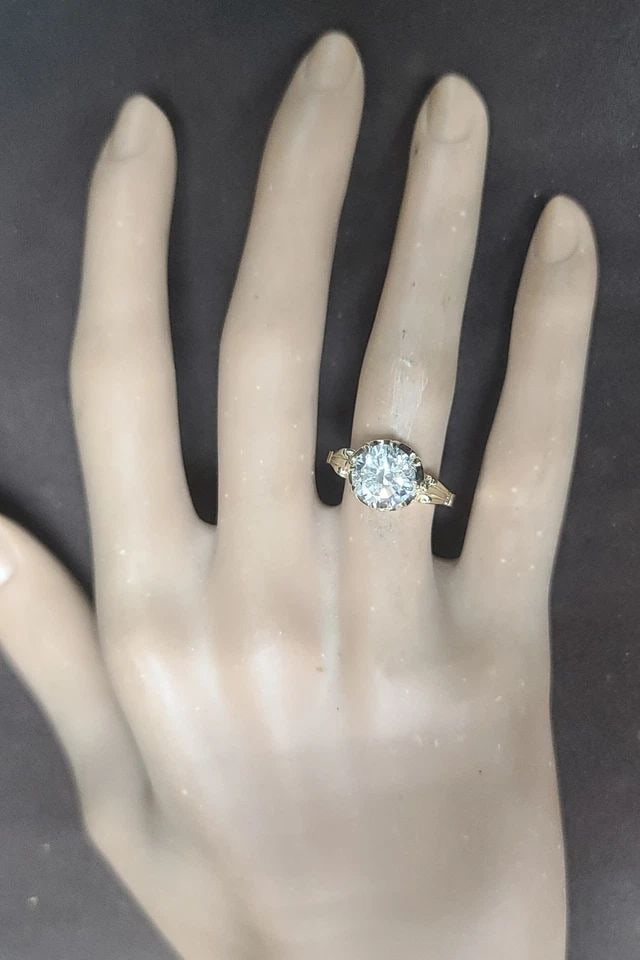 14K YELLOW GOLD VINTAGE ENGAGEMENT RING 2.20CT. LAB-GROWN ROUND DIAMOND: 14K YELLOW GOLD VINTAGE ENGAGEMENT RING 2.20CT. LAB-GROWN ROUND DIAMOND This stunning vintage Art Deco engagement ring is crafted in solid 14K yellow gold and features a lab-grown round-cut diamond at