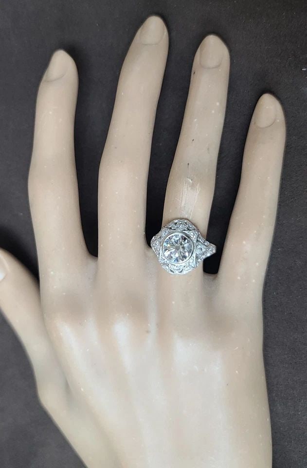 VINTAGE FILIGRE 14K WHITE GOLD RING 1.72CT.OLD EURO CUT ROUND LAB GROWN DIAMOND: VINTAGE FILIGRE 14K WHITE GOLD RING 1.72CT.OLD EURO CUT ROUND LAB GROWN DIAMOND This Vintage Filigree 14k White Gold Ring features a beautiful 1.72CT Old Euro Cut Round Lab Grown Diamond as the main s