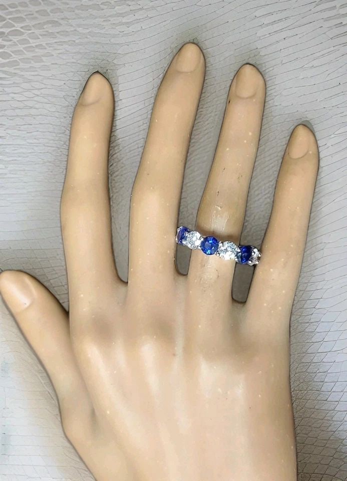 14K WHITE GOLD ETERNITY RING 9.73CT. DIAMOND BLUE SAPPHIRE ROUND SHAPE SIZE 6.5: 14K WHITE GOLD ETERNITY RING 9.73CT. DIAMOND BLUE SAPPHIRE ROUND SHAPE SIZE 6.5 This stunning eternity ring is crafted in solid 14K white gold, offering timeless elegance and modern luxury. The design