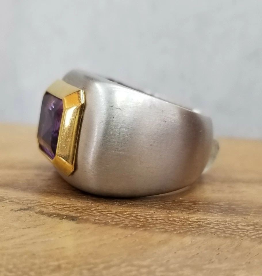 ITALIAN DESIGN 18K MULTI GOLD NATURAL AMETHYST RING 5.45CT IN EMERALD CUT: ITALIAN DESIGN 18K MULTI GOLD NATURAL AMETHYST RING 5.45CT IN EMERALD CUT GORGEOUS 18k multi tone GOLD natural amethyst ring Italian design. center natural amethyst in emerald shape weight 5.45ct size
