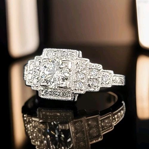 PLATINUM VINTAGE FILIGREE ENGAGEMENT RING 0.94CT. NATURAL ROUND DIAMOND: PLATINUM VINTAGE FILIGREE ENGAGEMENT RING 0.94CT. NATURAL ROUND DIAMOND This stunning vintage engagement band is a true beauty. Made of platinum, it features a round, natural diamond in a solitaire st