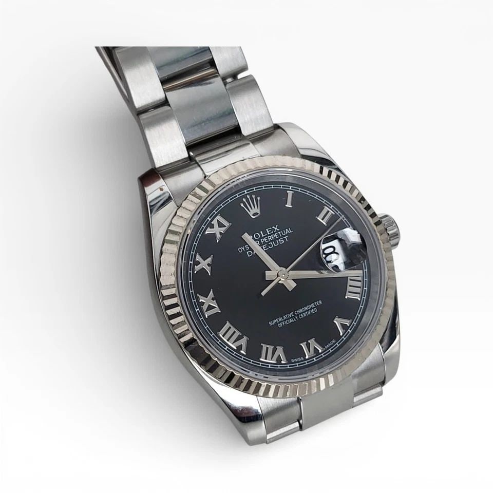 ROLEX DATEJUST 36MM STEEL BLACK ROMAN WHITE GOLD BEZEL WATCH 116234 D SERIE 2006: ROLEX DATEJUST 36MM STEEL BLACK ROMAN WHITE GOLD BEZEL WATCH Manufacturer Rolex Category Mens Datejust 36mm Subcategory Sapphire Crystal Quick Set Reference Number 116234 Band Stainless Steel Band Col