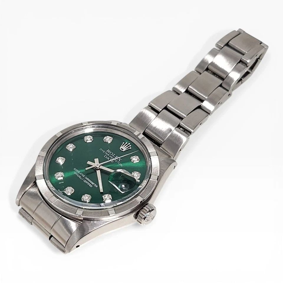 ROLEX DATE 34 MM GREEN DIAMOND DIAL STEEL OYSTER AUTOMATIC WATCH 1501 CIRCA 1972: ROLEX DATE 34 MM GREEN DIAMOND DIAL STEEL OYSTER AUTOMATIC WATCH Manufacturer Rolex Category Mens Date 34mm Reference Number 1501 Band Stainless Steel Band Color Steel Band Type Oyster Bezel Engine Tu