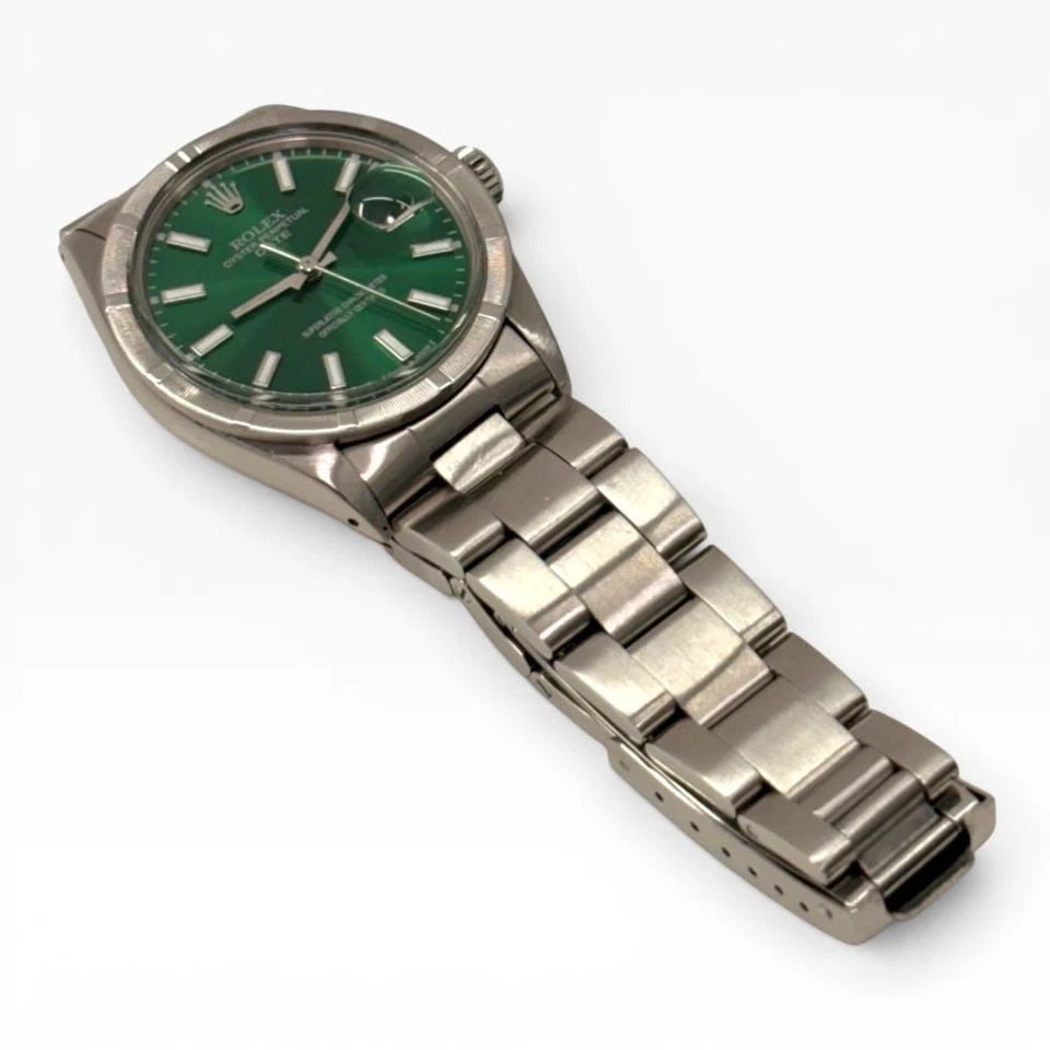 ROLEX DATE 34 MM GREEN DIAL STEEL OYSTER AUTOMATIC WATCH 1501 CIRCA 1973: ROLEX DATE 34 MM GREEN DIAL STEEL OYSTER AUTOMATIC WATCH 1501 CIRCA 1973 Manufacturer Rolex Category Mens Date 34mm Reference Number 1501 Band Stainless Steel Band Color Steel Band Type Oyster Bezel E