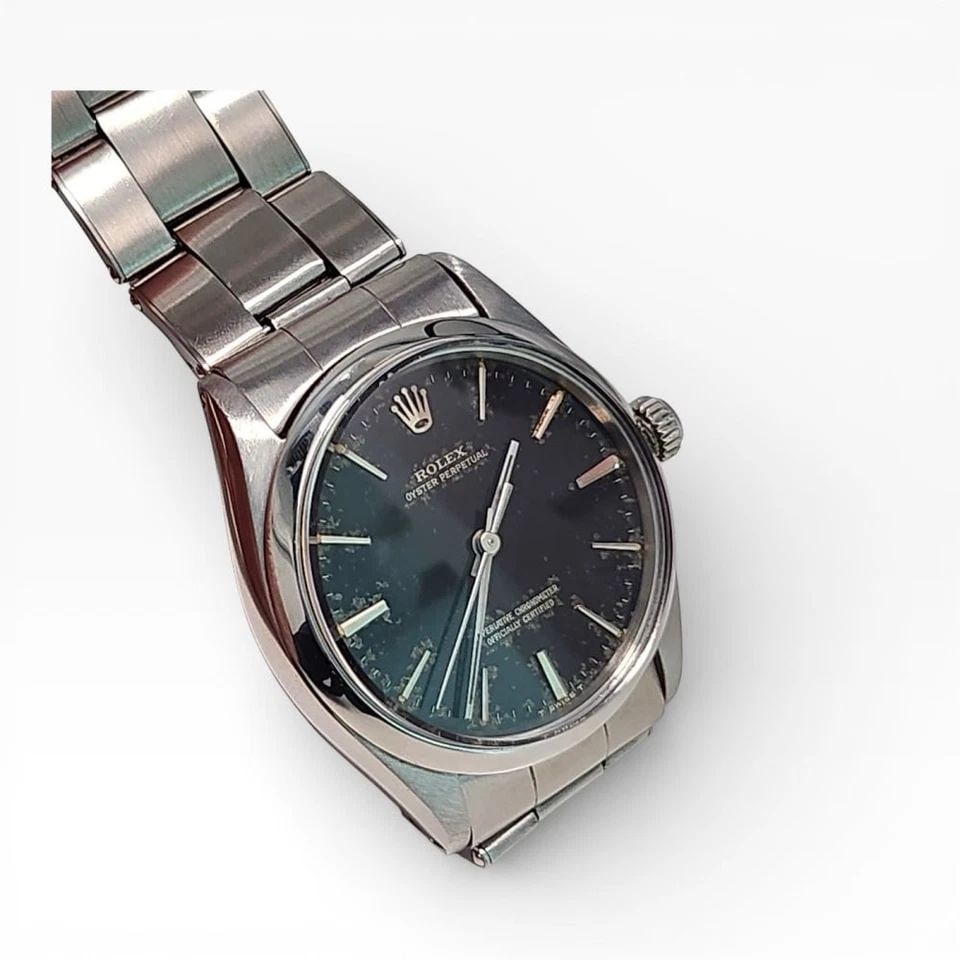 VINTAGE ROLEX OYSTER PERPETUAL 34 MM BLACK GILT DIAL STEEL WATCH 1002 CIRCA 1966: VINTAGE ROLEX OYSTER PERPETUAL 34 MM BLACK GILT DIAL STEEL WATCH Manufacturer Rolex Category Mens No Date 34mm Subcategory Plastic Crystal Reference Number 1002 Additional Keywords GILT DIAL VINTAGE B