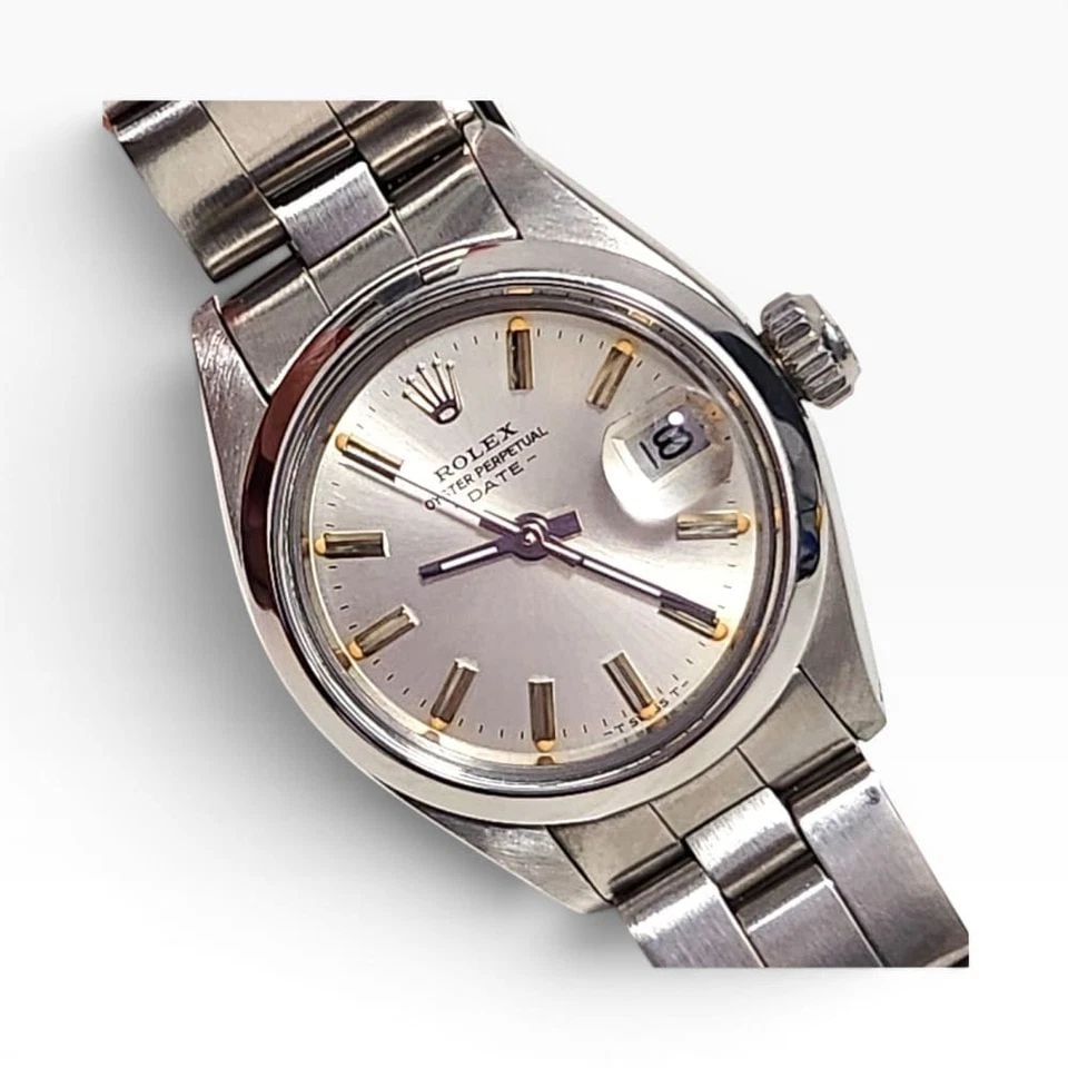 ROLEX LADIES DATE 26 MM STEEL OYSTER AUTOMATIC WATCH 6916 CIRCA 1979: ROLEX LADIES DATE 26 MM STEEL OYSTER AUTOMATIC WATCH 6916 CIRCA 1979 Manufacturer Rolex Category Oyster Perpetual Ladies Date Reference Number 6916 Band Stainless Steel Band Color Steel Band Type Oyst