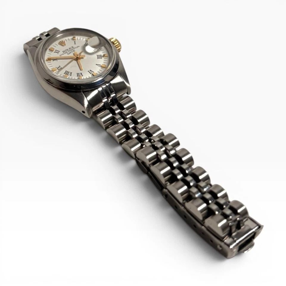 ROLEX LADIES DATE 26MM STEEL JUBILEE WHITE ROMAN AUTOMATIC WATCH 6916 CIRCA 1979: ROLEX LADIES DATE 26MM STEEL JUBILEE WHITE ROMAN AUTOMATIC WATCH 6916 CIRCA 1979 Manufacturer Rolex Category Oyster Perpetual Ladies Date Reference Number 6916 Band Stainless Steel Band Color Steel Ba
