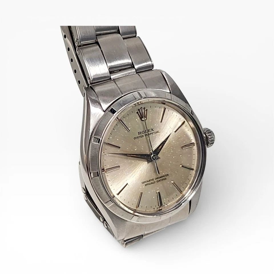 ROLEX DATE 34 MM STEEL OYSTER SILVER DIAL AUTOMATIC WATCH 1500 CIRCA 1980: ROLEX DATE 34 MM STEEL OYSTER SILVER DIAL AUTOMATIC WATCH Manufacturer Rolex Category Mens Date 34mm Subcategory Plastic Crystal Non Quick Reference Number 1500 Band Stainless Steel Band Color Steel B
