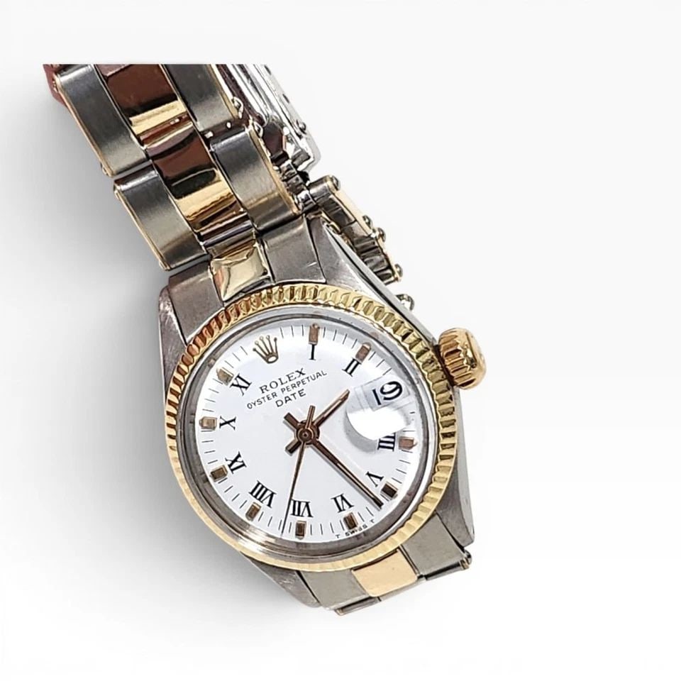ROLEX LADIES DATE 26 MM TWO TONE OYSTER AUTOMATIC WATCH 6917 CIRCA 1978: ROLEX LADIES DATE 26 MM TWO TONE OYSTER AUTOMATIC WATCH 6917 CIRCA 1978 Manufacturer Rolex Category Oyster Perpetual Ladies Date Reference Number 6917 Band Stainless Steel Band Color Steel Band Type O