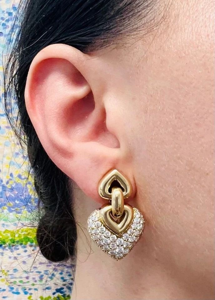 BVLGARI DOPPIO CUORE DIAMOND EARRINGS: BULGARI DOPPIO CUORE DIAMOND EARRINGS A pair of Bulgari Doppio Cuore diamond 18k gold earrings. The earrings are a part of sought-after Doppio Cuore collection. The earrings are designed as two dangli