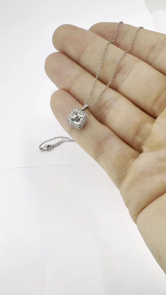 TIFFANY & CO. LEGACY PLATINUM DIAMOND PENDANT NECKLACE: TIFFANY & CO. LEGACY PLATINUM DIAMOND PENDANT NECKLACE KL AAOO Tiffany & Co. platinum cushion modified brilliant cut diamond pendant necklace, crafted as an estate Tiffany & Co. chain and pendant set.