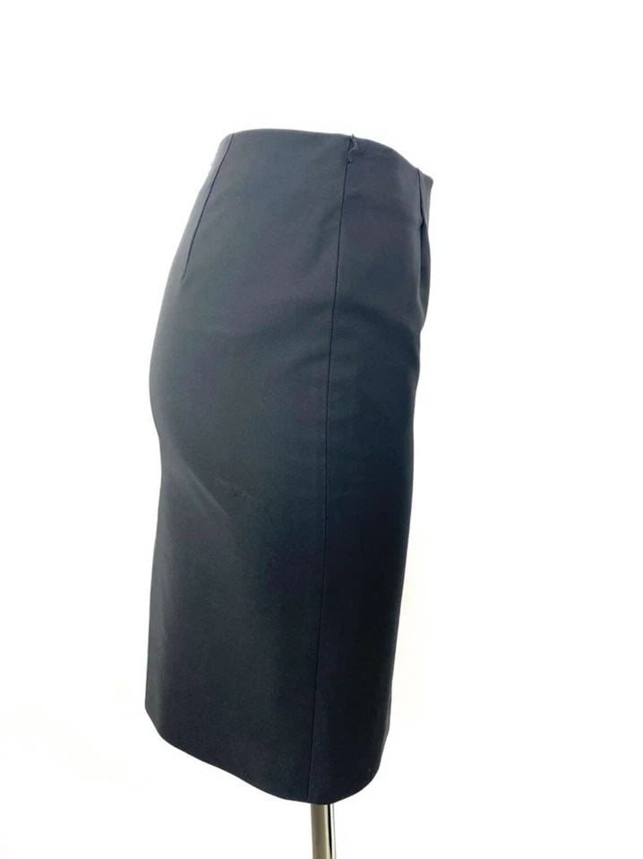 PRADA BLACK PENCIL SKIRT, SIZE 40: PRADA BLACK PENCIL SKIRT, SIZE 40 PRADA BLACK PENCIL SKIRT, SIZE 40 PRADA BLACK PENCIL SKIRT, SIZE 40 The skirt is designed by Prada, it features mini/ mid length, rear concealed zip closure and rear 