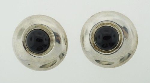 CLASSIC STERLING SILVER & ONYX CLIP ON EARRINGS CIRCA 1970S: CLASSIC STERLING SILVER & ONYX CLIP ON EARRINGS CIRCA 1970S Sterling Silver & Onyx Earrings. Wonderful pair of earrings that is a necessity in your collection.. Weight is 23.4 grams.. They are circa 1