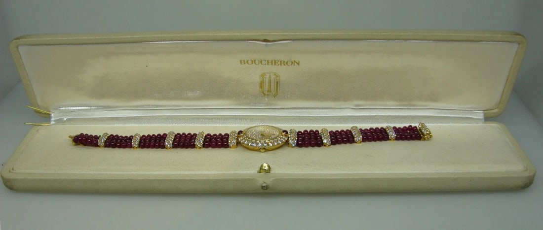 VINTAGE BOUCHERON 18K YELLOW GOLD LADY'S WATCH DIAMOND RUBY QUARTZ: VINTAGE BOUCHERON 18K YELLOW GOLD LADY'S WATCH DIAMOND RUBY QUARTZ BOUCHERON 18 karat Yellow Gold Diamond Ruby Lady's Watch Bracelet Elegant lady's watch made of 18 karat (stamped) yellow gold. The wa