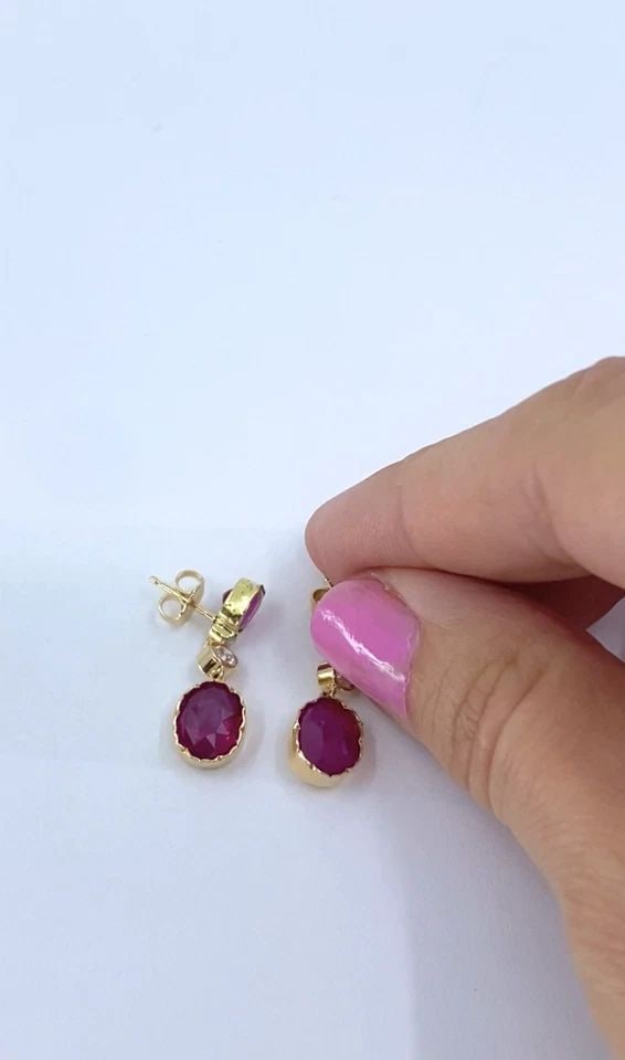 14K GOLD RUBY DROP EARRINGS DIAMOND ACCENT: 14K GOLD RUBY DROP EARRINGS DIAMOND ACCENT Materials 14K Gold, 12K Gold. G.F. Gemstone Ruby, Diamond Weight 4 Grams Measurement 1/4" x 1" Hallmarks 14K, 20.12K. G.F. ITEM DETAILS 14k Gold Ruby Drop Ea