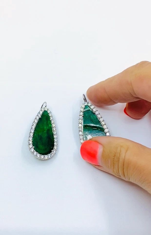 CARVED JADEITE DIAMOND EARRINGS 18K WHITE GOLD: CARVED JADEITE DIAMOND EARRINGS 18K WHITE GOLD DESIGNER: Unknown CIRCA: 1960’s MATERIALS: Rhodium-Plated 18K White Gold GEMSTONE: Carved Jadeite, Diamond WEIGHT: 11.1 grams MEASUREMENTS: 3/4" x 1 1/