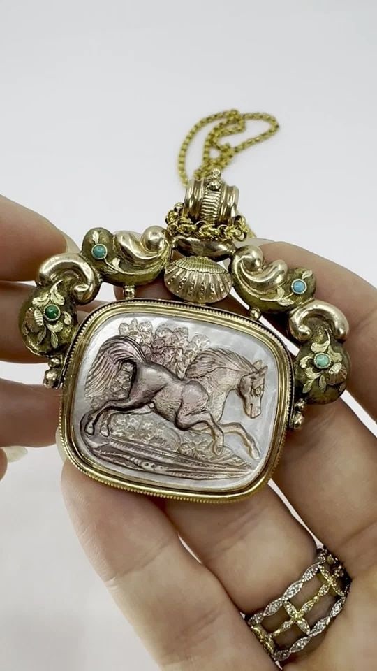 ANTIQUE VICTORIAN GOLD MOTHER OF PEARL EQUESTRIAN PENDANT CHAIN NECKLACE: ANTIQUE VICTORIAN GOLD MOTHER OF PEARL EQUESTRIAN PENDANT CHAIN NECKLACE This antique pendant necklace combines intricate artistry with substantial gold weight, making it both a wearable jewel and a c