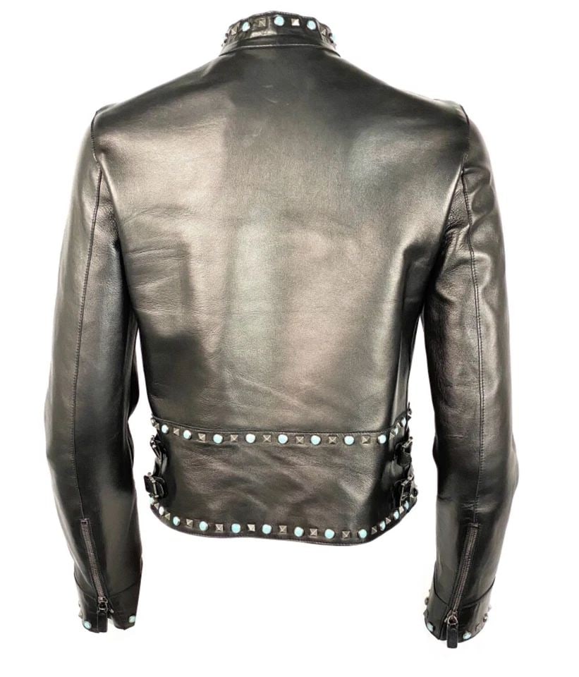 VALENTINO BLACK LEATHER STUDDED JACKET SIZE 8: VALENTINO BLACK LEATHER STUDDED JACKET SIZE 8 VALENTINO BLACK LEATHER STUDDED JACKET SIZE 8 Size 8 Silver tone geometric and turquoise round studs detail Collar Zip closure Two front zipped pockets Tw
