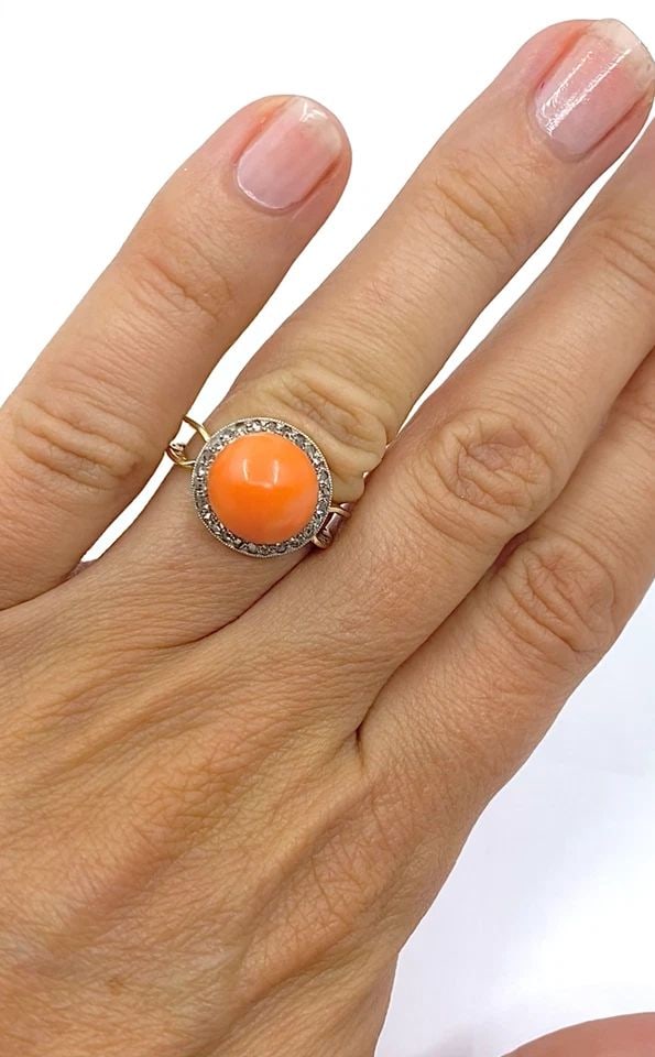 VINTAGE 14K GOLD CORAL CABOCHON DIAMOND HALO RING: VINTAGE 14K GOLD CORAL CABOCHON DIAMOND HALO RING CIRCA 1970s MATERIALS 14k Gold GEMSTONE Coral, Diamond WEIGHT 4.4 grams MEASUREMENTS Top - 9/16" RING SIZE 5.75 HALLMARKS 14K ITEM DETAILS Vintage 14k