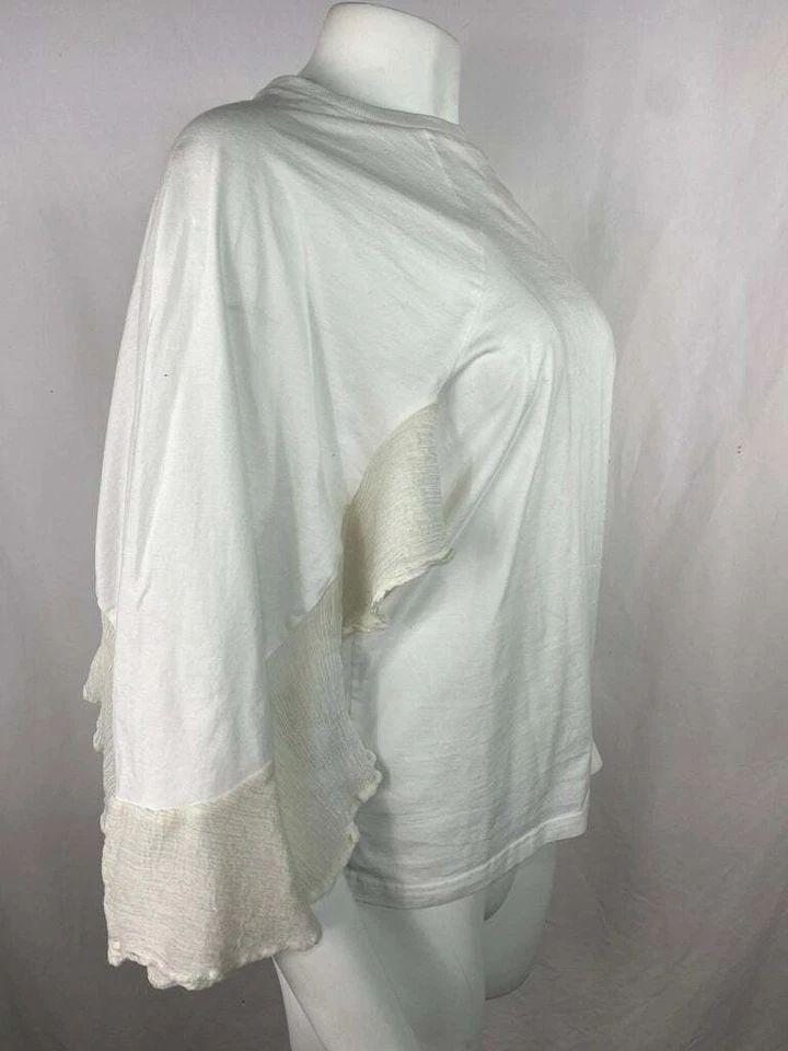 CHLOE WHITE COTTON TOP BLOUSE, SIZE MEDIUM: CHLOE WHITE COTTON TOP BLOUSE, SIZE MEDIUM CHLOE WHITE COTTON TOP BLOUSE, SIZE MEDIUM The top features cape style with flare sleeves with ruffled finish detail and crew neck line. Length: 25 in. (63.5