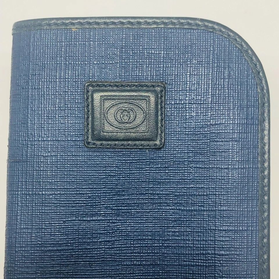 VINTAGE GUCCI NAVY LEATHER SUNGLASSES CASE: VINTAGE GUCCI NAVY LEATHER SUNGLASSES CASE VINTAGE GUCCI NAVY LEATHER SUNGLASSES CASE Vintage GUCCI Navy Leather Sunglasses Case Navy Leather Faded double G pattern 6.75”H x 3.25”W 030 416