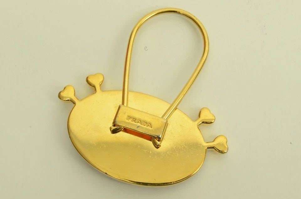 AUTHENTIC PRADA LEATHER BAG CHARM OVAL TAG GP ACCESSORY EMBLEM CLIP COLLECTIBLE: AUTHENTIC PRADA LEATHER BAG CHARM OVAL TAG GP ACCESSORY EMBLEM CLIP COLLECTIBLE Authentic Prada Leather Bag Charm Oval Tag GP Accessory Emblem Clip Collectible Authentic Prada Leather Bag Charm Oval T