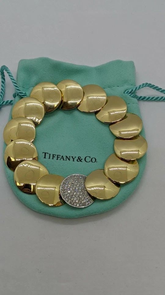 1981 TIFFANY & CO. 18K YELLOW GOLD PLATINUM DIAMOND DISC BRACELET 7.25" LONG: 1981 Tiffany & Co. 18K Yellow Gold Platinum Pave Diamond Disc Bracelet Length - 7.25" Long Total Weight - 53.4 Grams Professionally Polished & Looks Brand New Pouch Included **Hallmarks Slight Faded f