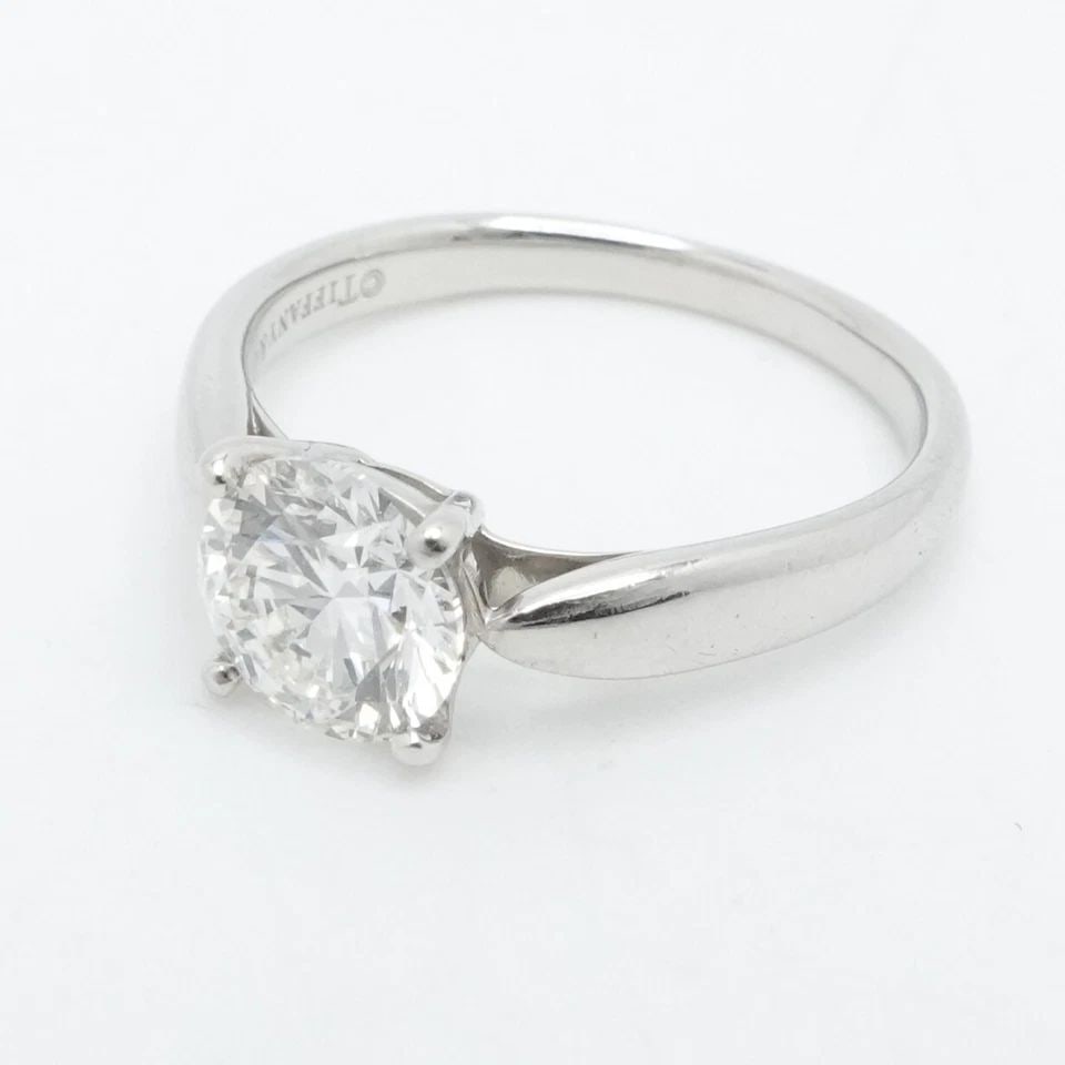 TIFFANY & CO. HARMONY PLATINUM 1.06CT DIAMOND H VS2 ENGAGAMENT RING SIZE 5 PAPER: TIFFANY & CO. HARMONY PLATINUM 1.06CT DIAMOND H VS2 ENGAGAMENT RING SIZE 5 PAPER Tiffany & Co. Tiffany Harmony Platinum Round Brilliant Diamond Engagement Ring Size - 5 Band Width - 2mm Diamond Carat 