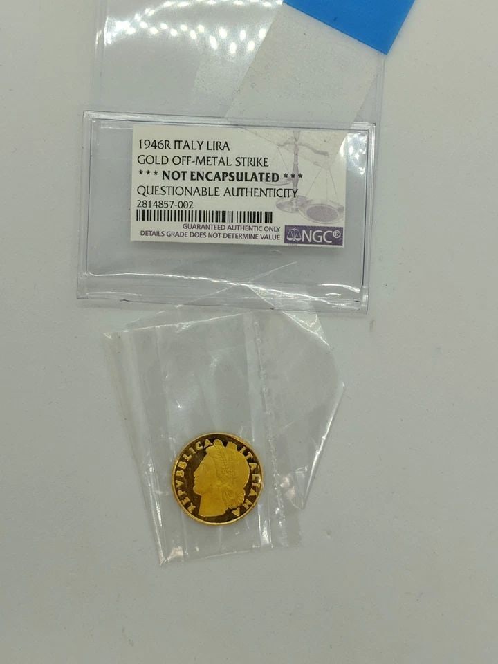 1946R ITALY GOLD OFF-METAL STRIKE LIRA - NGC GRADED -18K GOLD COIN - 1 LIRA GOLD: 1946R ITALY GOLD OFF-METAL STRIKE ONE LIRA 18K Gold Coin Total Weight - 3.0 Grams NGC Graded *** NOT ENCAPSULATED *** QUESTIONABLE AUTHENTICITY RARE FINE