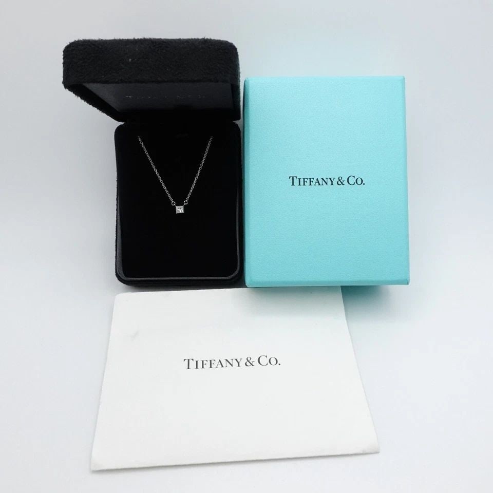 TIFFANY & CO. PLATINUM PRINCESS DIAMOND MINI PENDANT NECKLACE 16" BOX & RECEIPT: Tiffany & Co. Platinum Princess Diamond Mini Charm Pendant Necklace Length - 16" Pendant Width - 4mm Total Weight - 2.4 Grams Date of Purchase - 05/27/2011 Box, Case, & Proof of Purchase Included
