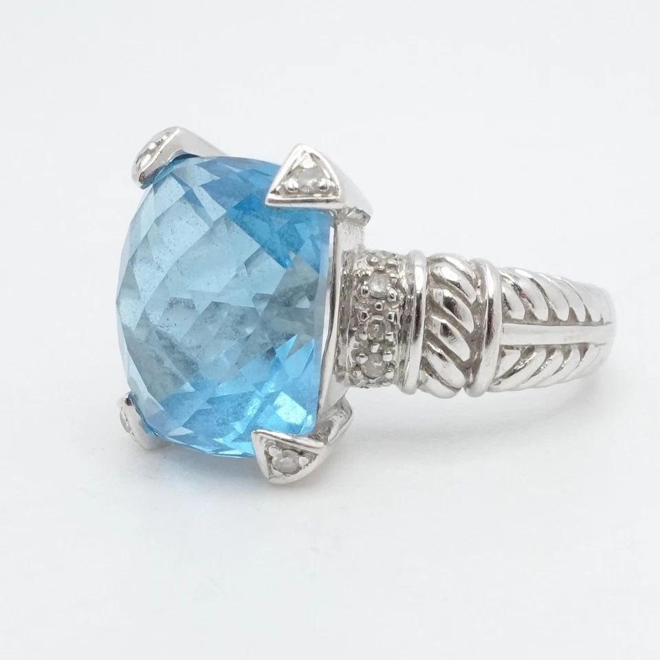 14K WHITE GOLD BLUE TOPAZ & DIAMOND COCKTAIL RING SIZE 7: 14K WHITE GOLD BLUE TOPAZ & DIAMOND COCKTAIL RING SIZE 7 14K White Gold Blue Topaz & Diamond Cocktail Ring Size - 7 Band Width - 3mm Gemstone Size - 12.5mm x 11mm Total Weight - 7.7 Grams
