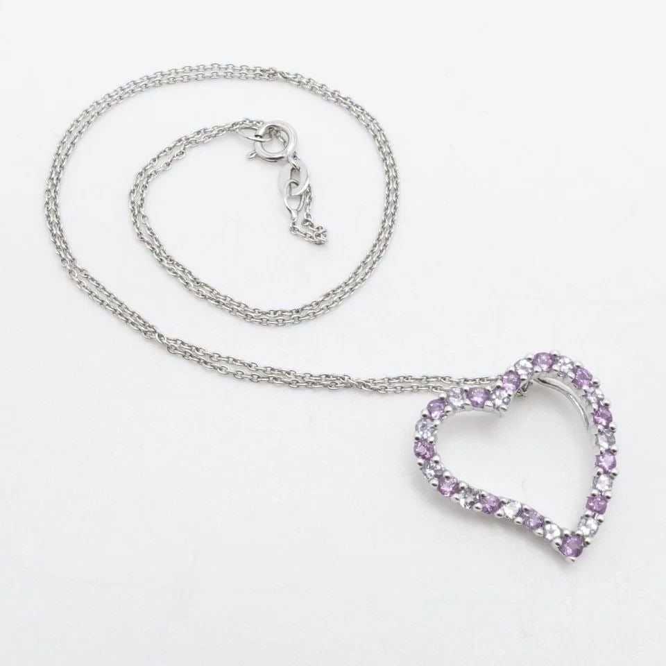 B.H 14K WHITE GOLD AMETHYST & TANZANITE OPEN HEART PENDANT NECKLACE 16" RECEIPT: B.H 14K WHITE GOLD AMETHYST & TANZANITE OPEN HEART PENDANT NECKLACE 16" RECEIPT Signed B.H 14K White Gold Amethyst and Tanzanite Heart Pendant Chain Necklace Length - 16" Long Chain Width - 1mm Pendan