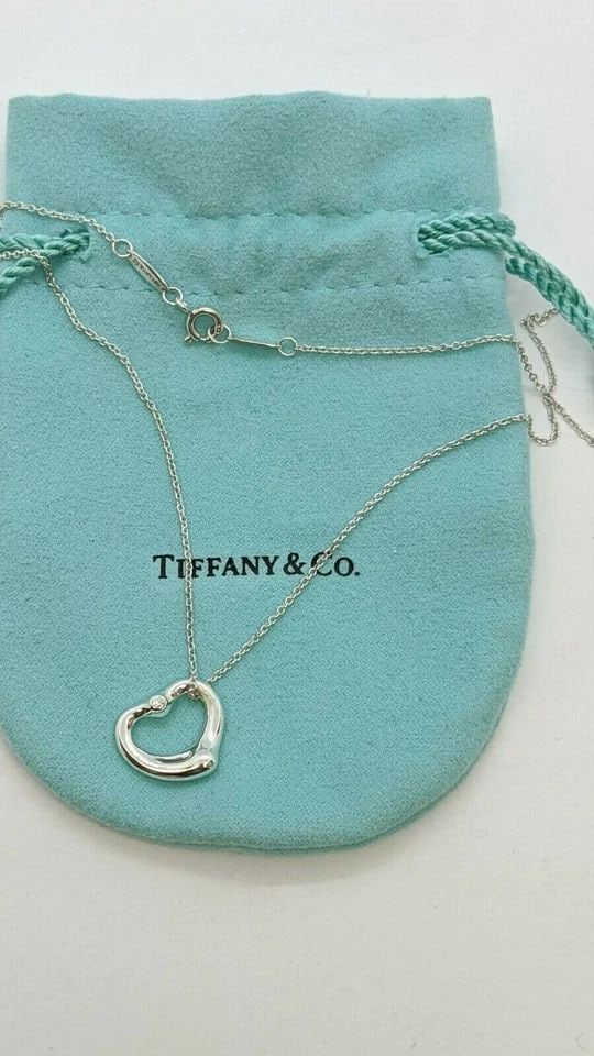 TIFFANY & CO. ELSA PERETTI SILVER OPEN HEART SMALL PENDANT DIAMOND NECKLACE 16": Tiffany & Co. Elsa Peretti Sterling Silver Open Heart Diamond Small Pendant Necklace Pendant Size -16mm Wide Chain Length - 16" Long Total Weight - 3.4 Grams Professionally Polished & Looks Brand New 