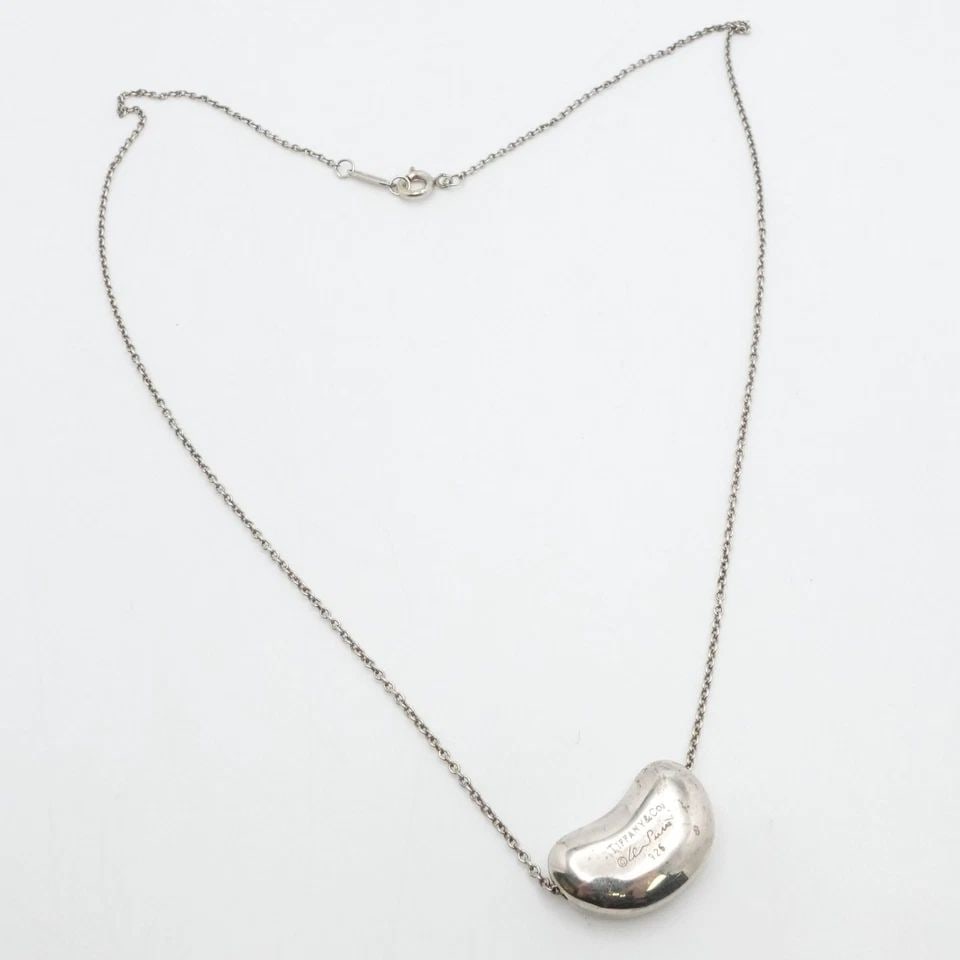 TIFFANY & CO. PERETTI STERLING SILVER 20MM BEAN PENDANT NECKLACE 18": TIFFANY & CO. PERETTI STERLING SILVER 20MM BEAN PENDANT NECKLACE 18" Tiffany & Co. Elsa Peretti Sterling Silver 20mm Bean Pendant Necklace Length - 18" Chain Width - 1mm Pendant Size (LxW) - 13mm x 20