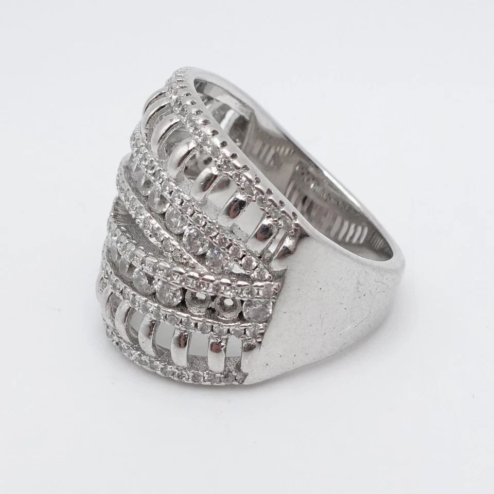 STERLING SILVER ROUND CLEAR CZ CUBIC ZIRCONIA CROSSOVER WIDE RING SIZE 7.5: STERLING SILVER ROUND CLEAR CZ CUBIC ZIRCONIA CROSSOVER WIDE RING SIZE 7.5 Sterling Silver Round Clear Cubic Zirconia Crossover Wide Ring Size - 7.5 Band Width - 4mm Total Weight - 10 Grams