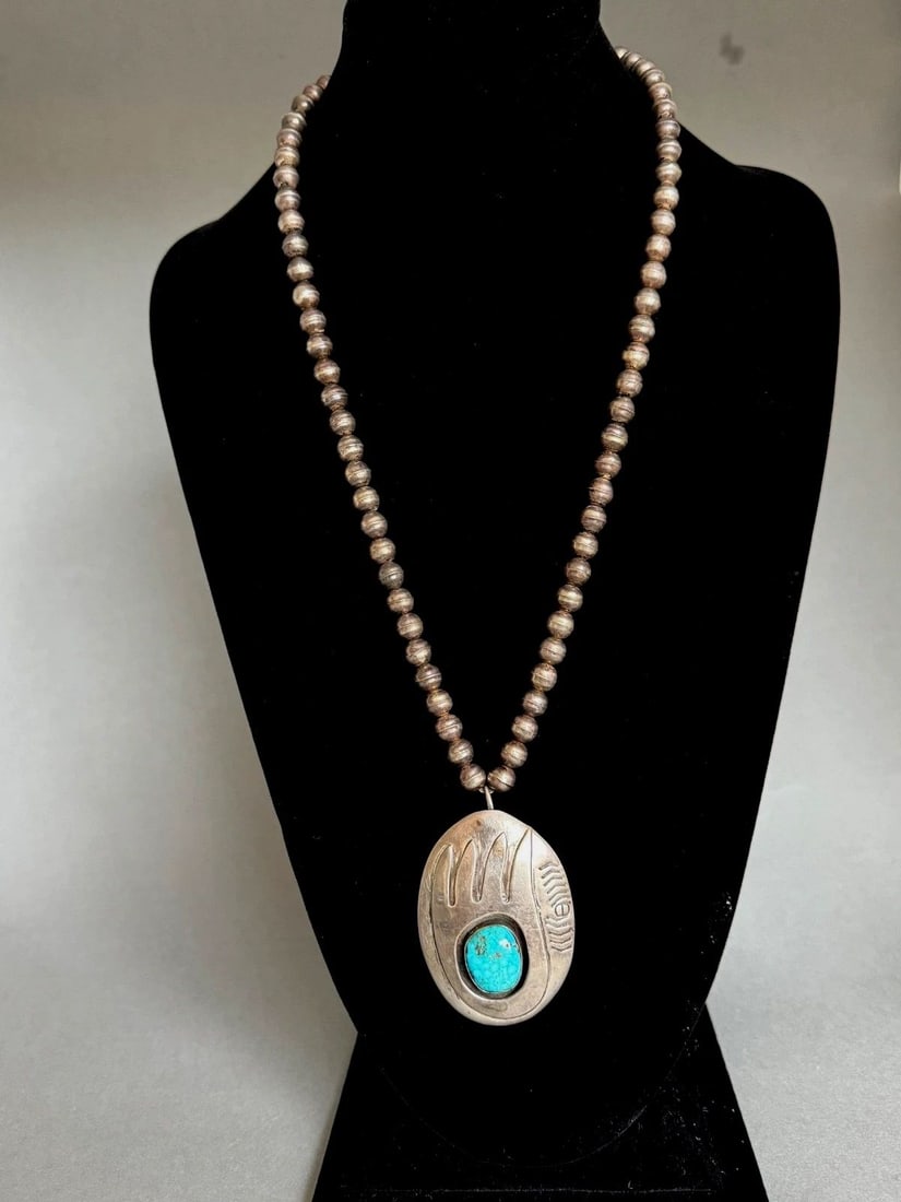 OLD PAWN NAVAJO STERLING SILVER NECKLACE. BEAR PAW PENDANT WITH TURQUOISE.: OLD PAWN NAVAJO STERLING SILVER NECKLACE. BEAR PAW PENDANT WITH TURQUOISE. Nice Necklace ..23 1/2 " Long with 1/4" bench press Sterling Beads ...Pendant Measures 2 5/8" Tall 1 3/4" Wide .. Signed DG W