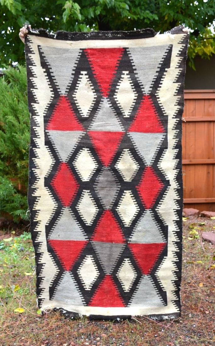 LARGE OLD NAVAJO RUG - EYEDAZZLER DIAMOND DESIGN RED BLACK WHITE GRAY - 78 X 43: LARGE OLD NAVAJO RUG - EYEDAZZLER DIAMOND DESIGN RED BLACK WHITE GRAY - 78 X 43 This old Eyedazzler Navajo rug shows a serrated diamond design in nice Ganado colors. It has a nice border. This old rug