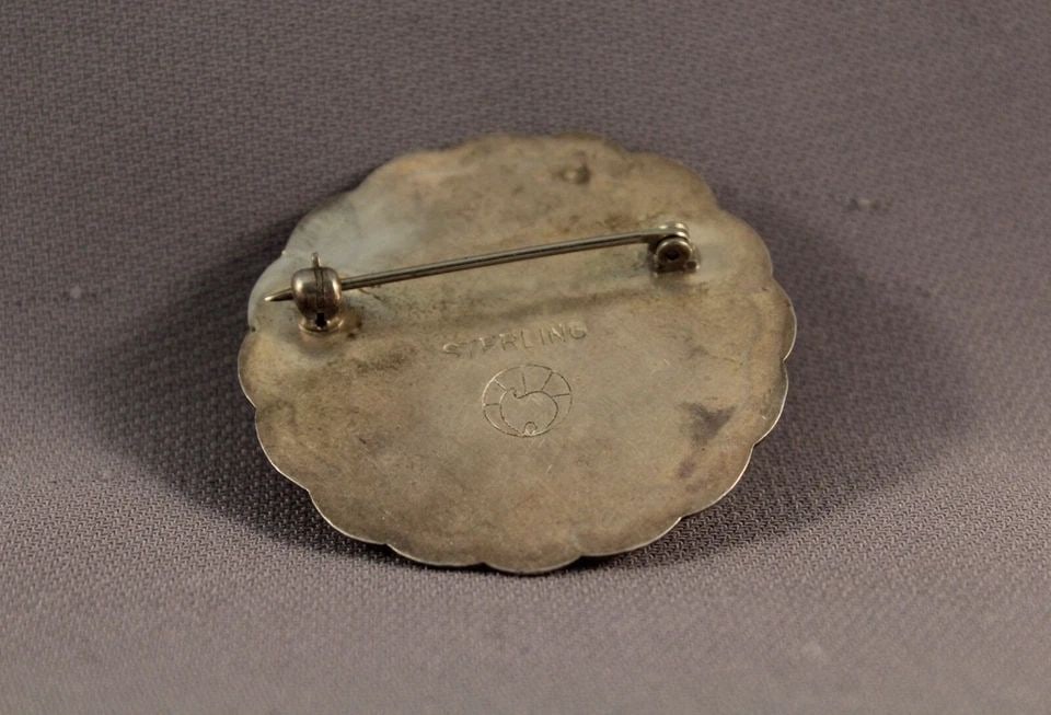 OLD PAWN STERLING SILVER AND STONE NAVAJO PIN - 1 5/8" ACROSS: OLD PAWN STERLING SILVER AND STONE NAVAJO PIN - 1 5/8" ACROSS Item Description: This pin measures 1 5/8" across and weighs 18 grams. It is marked sterling and is in great vintage condition.
