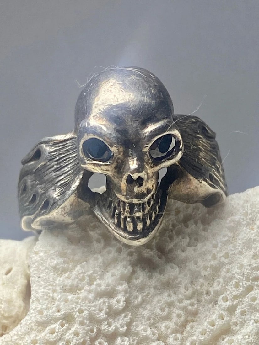 SKULL RING SIZE 8.75 BIKER FLAMES BAND STERLING SILVER WOMEN MEN: SKULL RING SIZE 8.75 BIKER FLAMES BAND STERLING SILVER WOMEN MEN Skull ring size 8.75 biker flames band w blue eyes sterling silver women men Size 8.75 Weight 11.9g Widest 3/4" Thinnest part 1/8"