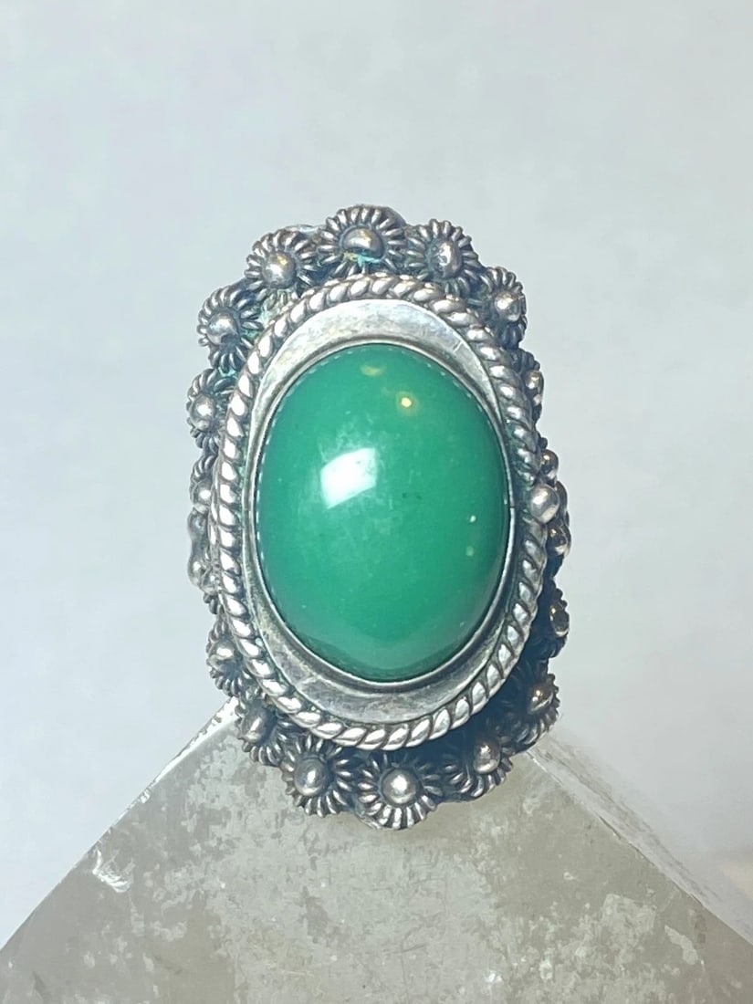 POISON RING GREEN MEXICAN STERLING SILVER WOMEN: POISON RING GREEN MEXICAN STERLING SILVER WOMEN Poison ring green Mexican sterling silver women size 9.25 adjustable Weight. 22.1g Length. 1 1/2" Width 3/4" Thinnest back of band 1/4"