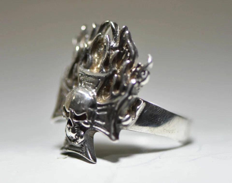 SKULL RING BIKER BAND FLAMES GREEK CROSS STERLING SILVER MEN: SKULL RING BIKER BAND FLAMES GREEK CROSS STERLING SILVER MEN Skull Ring biker band flames Greek Cross sterling silver men Size . 10.50 weight 14.9g Length of front 1 1/4" Width of band . 15/16" Thinne