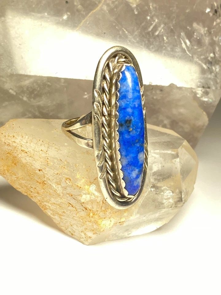 LONG BLUE LAPIS ? RING NAVAJO SOUTHWEST STERLING SILVER WOMEN: LONG BLUE LAPIS ? RING NAVAJO SOUTHWEST STERLING SILVER WOMEN Long blue lapis ? or sodalite Ring southwest sterling silver women Size 6.75 Weight 9 Length. 1 5/8" Width. 5/8" Thinnest part of band 1/8