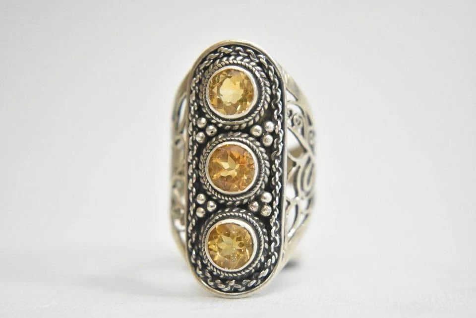 CITRINE RING SIZE 6.75 LONG STERLING SILVER WOMEN: CITRINE RING SIZE 6.75 LONG STERLING SILVER WOMEN Citrine ring long sterling silver women Size 6.75 Weight 8.4g Widest part of band 1 1/4" Thinnest part of band 3/16"
