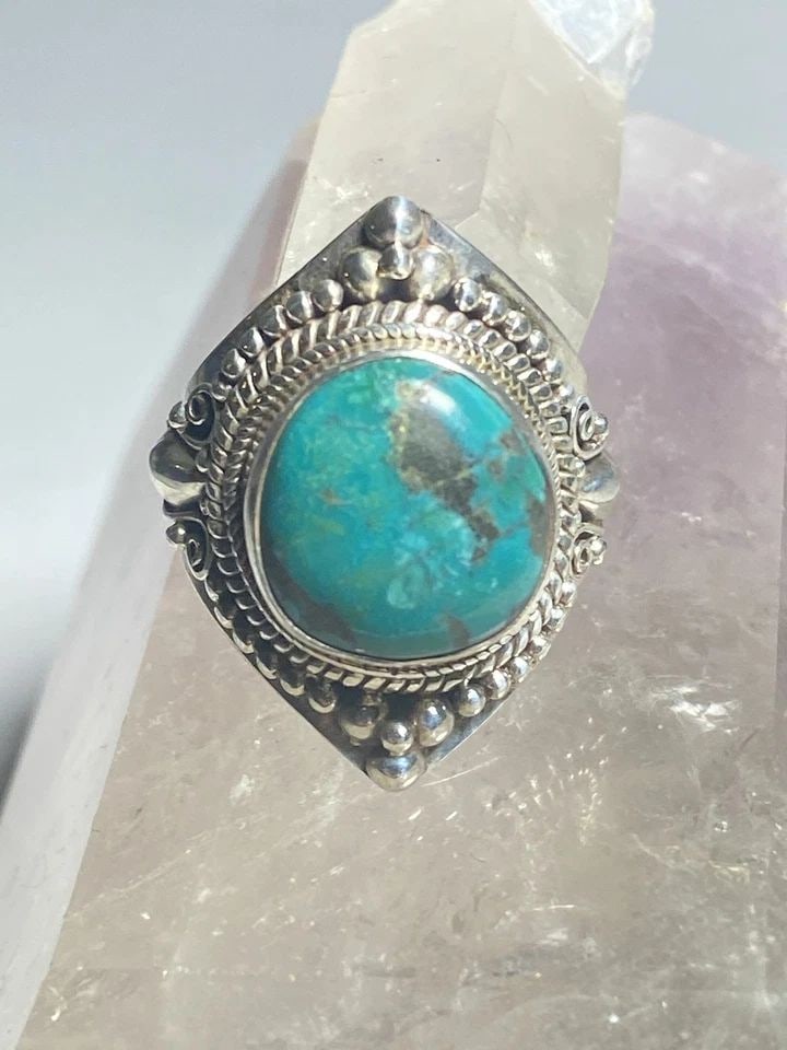 TURQUOISE RING TWIST STERLING SILVER WOMEN MEN: TURQUOISE RING TWIST STERLING SILVER WOMEN MEN Turquoise ring twist sterling silver women men Size 8.50 Weight 10.8g Length.1 1/8" of setting Length of stone. 9/16" Width of stone 7/16 " Thinnest part