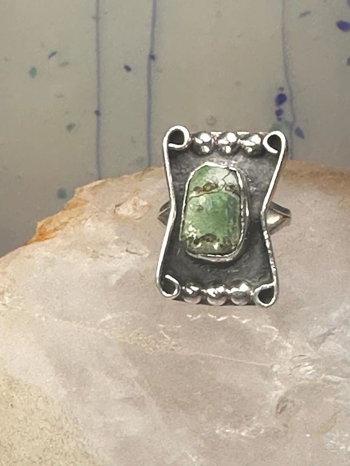 TURQUOISE NAVAJO SIZE 7.25 STERLING SILVER WOMEN: TURQUOISE NAVAJO SIZE 7.25 STERLING SILVER WOMEN Turquoise Navajo size 7.25 sterling silver women Size 7.25 Weight. 6g Length 1” Width 3/4” Band in Back. 1/8"