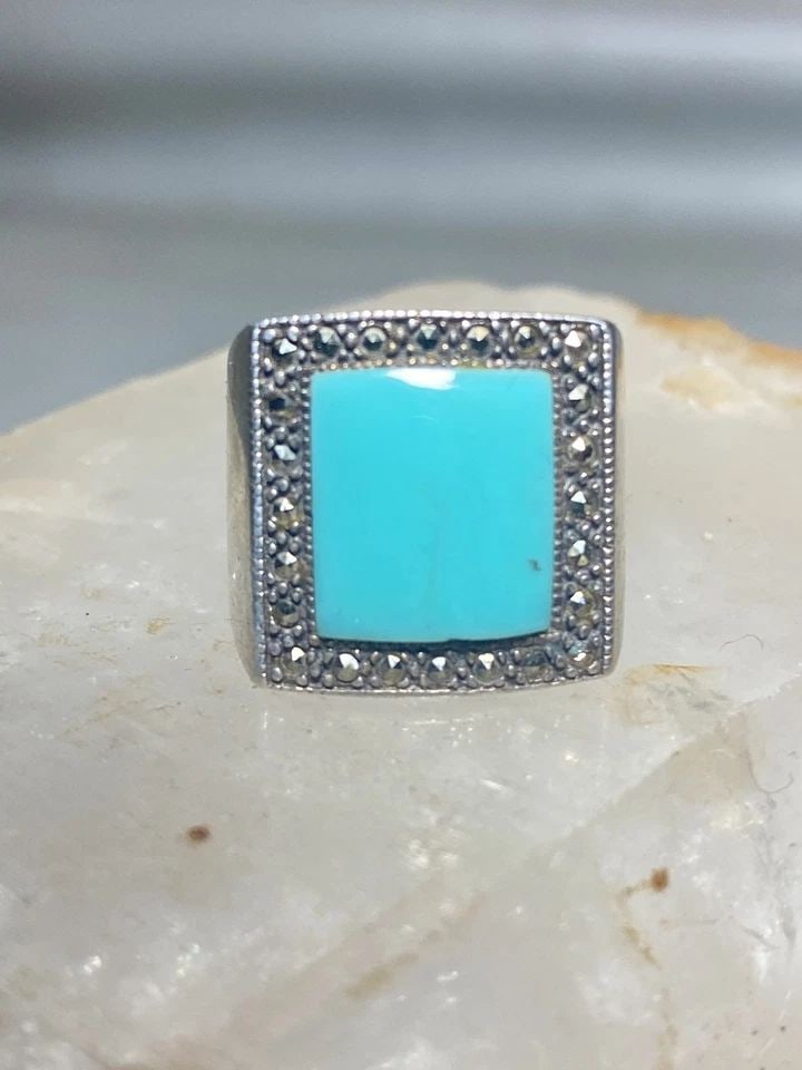 TURQUOISE RING SIZE 5.75 MARCASITES BAND MID CENTURY STERLING SILVER WOMEN: TURQUOISE RING SIZE 5.75 MARCASITES BAND MID CENTURY STERLING SILVER WOMEN Turquoise ring marcasites band mid century sterling silver women Size 5.75 Weight. 8g Length 3/4" Width 5/8" Thinnest part of