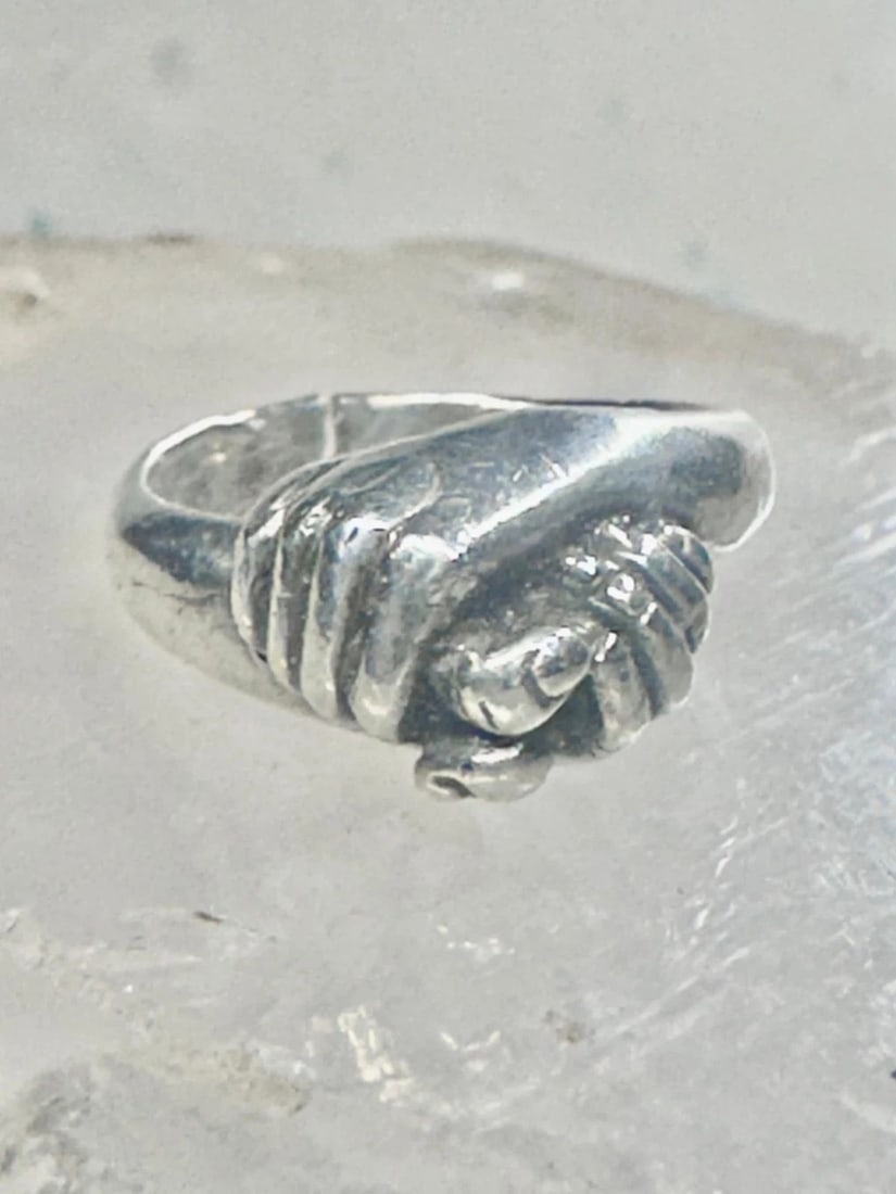 HOLDING HANDS RING SIZE 5.50 BAND STERLING SILVER WOMEN AS IS: HOLDING HANDS RING SIZE 5.50 BAND STERLING SILVER WOMEN AS IS Holding Hands ring Size 5.50 band sterling silver women AS IS ****Band is CUT**** Size 5.50 Weight. 6.5g Width 3/8" Band in Back 1/8"