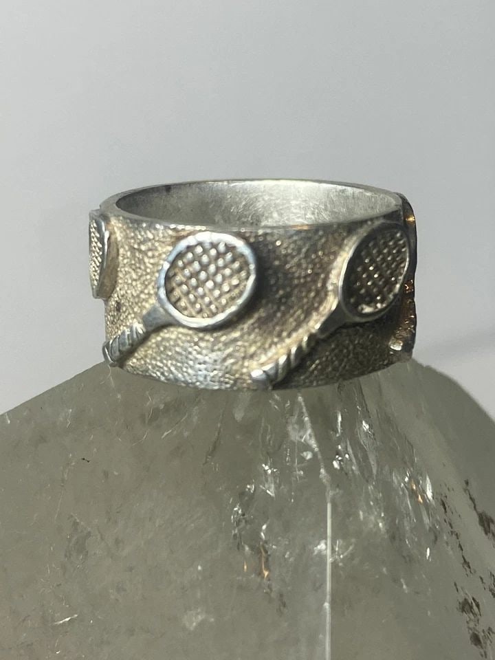TENNIS RING RACQUET BAND STERLING SILVER WOMEN GIRLS: TENNIS RING RACQUET BAND STERLING SILVER WOMEN GIRLS Tennis ring racquet band sterling silver women girls Size 5.50 Between a size 5.50 and a size 5.75 Weight 7.4g Band Width 3/8"